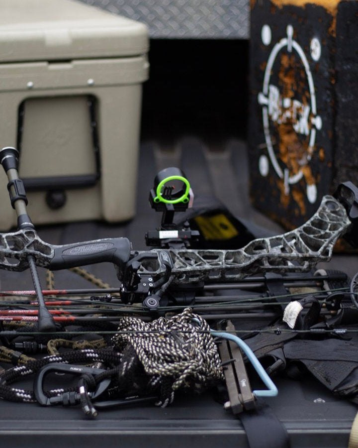 asio gear layed out on truck bed in preparation for a whitetail bow hunt. cut no corners. make sure all your gear is ready to go