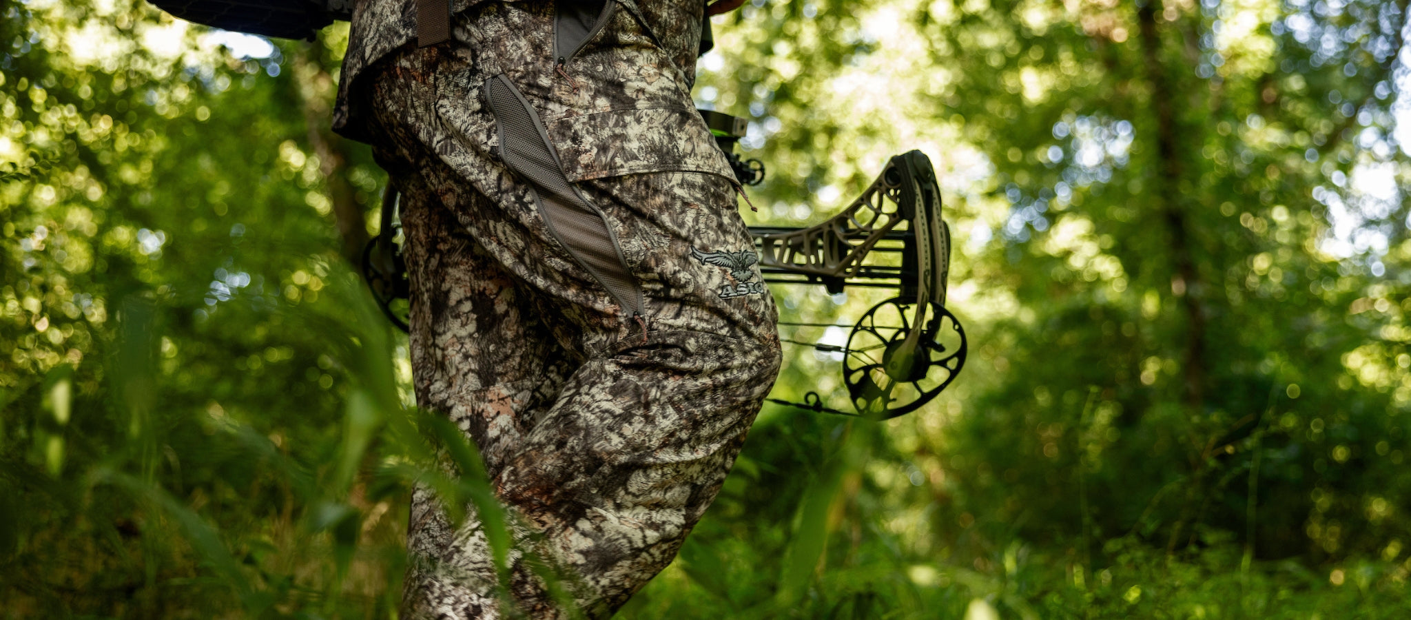 hunter walking in lightweight pants by asio gear in raptor camo