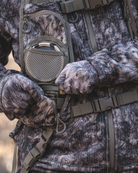 ASIO Gear RAPX camo turkey vest detail showing shotgun shell pocket and quick-access storage in the field