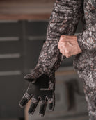 Close-up of RAPTOR camo heavyweight insulated glove showing grip texture and articulated fit on palm and fingers