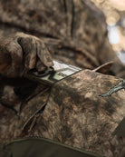ASIO Gear Midweight Bomb Pant in RAPX camo featuring secure multiple pocket design for bowhunters best used for securing phone, rangefinder, wind check, or other useful gear